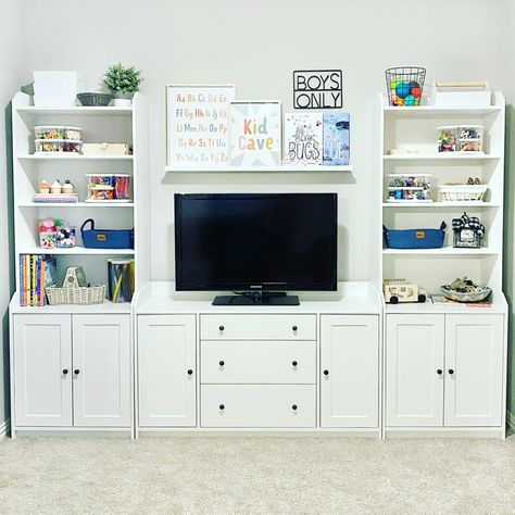 Follow Me On Instagram @alifemoreorganized - https://www.instagram.com/alifemoreorganized/ #playroom #playroomorganization #organizedplayroom #ikea #ikeaplayroom #ikeafurniture #ikeahauga #hauga #ikeabookshelf #bookshelf #bookshelves #whitebookshelf #wallshelf #wallshelves #shelfie #tvstand #toyorganization #organizedtoys #playroomdecor #playroominspo #playroomideas #playroomdesign #playroomgoals #playroomstorage #toystorage #craftsupplies #craftsupply #safariltd #lazysusan #organization Ikea Hauga Storage Playroom, Playroom Storage With Tv, Playroom With Black Furniture, Ikea Hauga Playroom, Ikea Playroom With Tv, Playroom Organization With Tv, Ikea Bookshelf Playroom, Hauga Ikea Living Room, Toy Storage Bookshelf