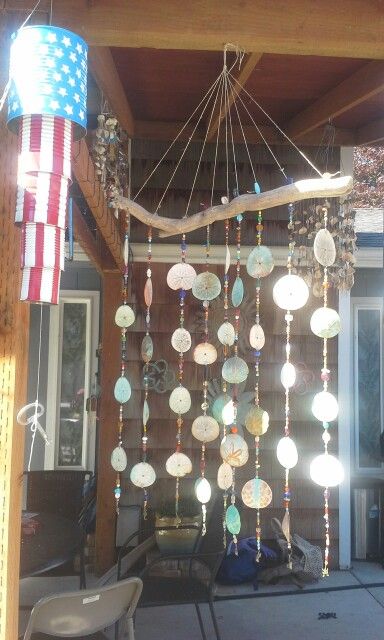 Sand Dollar Ideas Diy, Ideas For Sand Dollars, Craft With Sand Dollars, Sand Dollar Wind Chime, Sand Dollar Craft Wall Decor, Things To Do With Sand Dollars, Sand Dollar Diy, Diy Sand Dollar Crafts, Sand Dollar Crafts Ideas