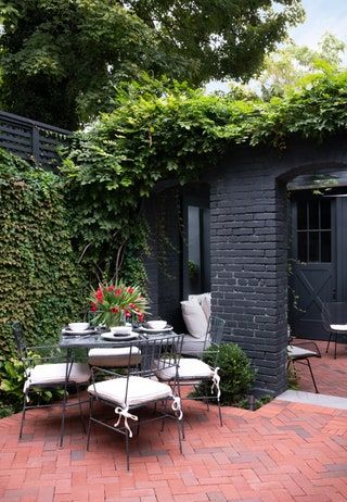 Tour a Washington, DC, Row House With Period-Perfect Victorian Details and a Touch of ’80s Style | Architectural Digest Dc Row House Interior, Row House Backyard, Victorian Details, Georgetown Dc, Burled Wood Coffee Table, Brick Houses, Native Gardens, Garage Apartment, Austin Homes