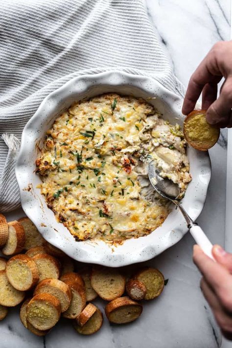 Hot, bubbling crab artichoke dip with melted fontina cheese is the seriously addictive appetizer you need for your next party. Crab Artichoke Dip, Bday Food, Crab And Artichoke Dip, Female Foodie, Marinated Artichoke Hearts, Lump Crab Meat, Fontina Cheese, Crab Dip, Artichoke Dip