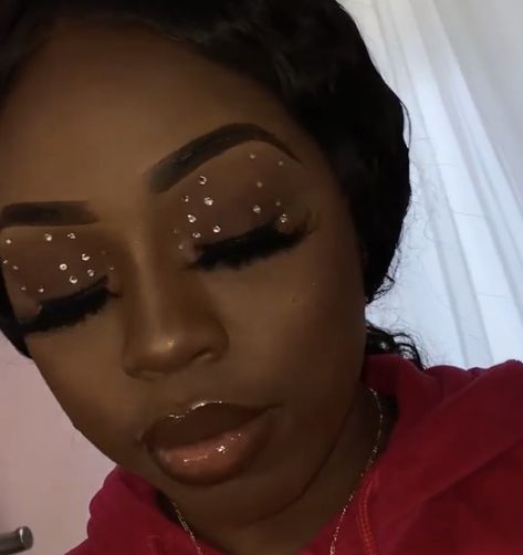 Soft rhinestone glam for black women by __pinkglam #makeupforblackwomen #rhinestonemakeup #makeupforwoc Black Makeup Looks With Rhinestones, Soft Makeup With Rhinestones, Natural Makeup For Black Women With Rhinestones, Dark Rhinestone Makeup, Natural Makeup With Rhinestones, Eye Gems Makeup Rhinestones, Rhinestone Makeup Looks Black Women, Rine Stone Makeup Black Women, Diamond Makeup Looks