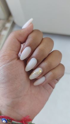 Gold Leaf Gel Nails, Gold Leaf Wedding Nails, White And Gold Acrylic Nails Almond, Milky White Nails With Gold Glitter, Acrylic Nail Designs Milky White, Almond Nails Designs Milky White, White Almond Nails With Accent Nail, Nail Designs With Gold Leaf, Milky Acrylic Nails Almond