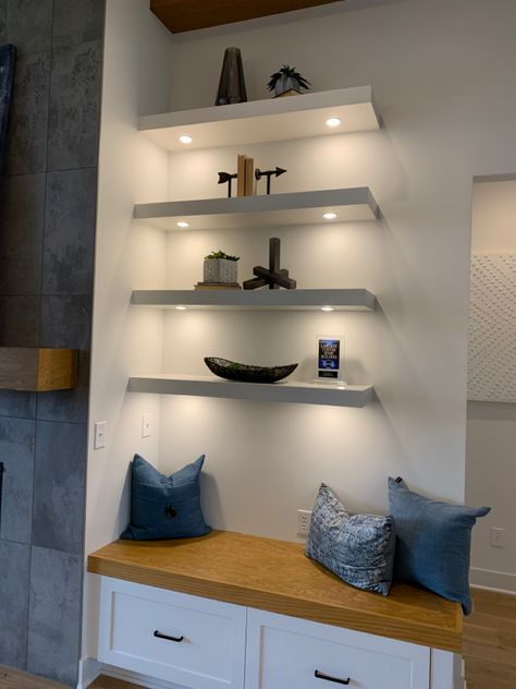 Floating Bookshelves With Lights, Floating Shelves With Lamp, Four Floating Shelves Arrangement, Floating White Shelves Bedroom, Under Bookshelf Lighting, Theater Room Floating Shelves, Modern Floating Shelves Bedroom, Wall Length Floating Shelves, Art On Floating Shelves