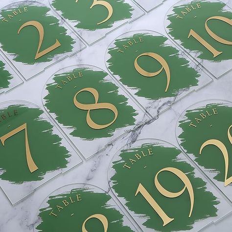 Arch wedding decor is a new trending and minimalist will never go out of style. These arch acrylic table number with holders are best choice for your wedding reception Turl Green Painted: These modern table numbers are made out of high quality acrylic sheet, the lettering is gold foil which printed on front side Green Painted Arch, Arch Wedding Decor, Painted Arch, Modern Table Numbers, Table Number Stands, Sage Green Paint, Acrylic Table Number, Acrylic Signage, Arch Wedding