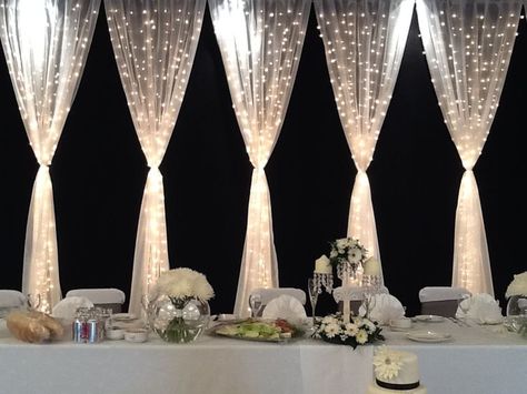 Pretty backdrop for the wedding party table. Gorgeous.  Tulle and twinkle lights make beautiful wedding decor. Maybe make it lavender Wedding Party Table, Head Table, Twinkle Lights, Wedding Planners, Here Comes The Bride, Reception Decorations, Wedding Backdrop, Wedding Bells, The Table