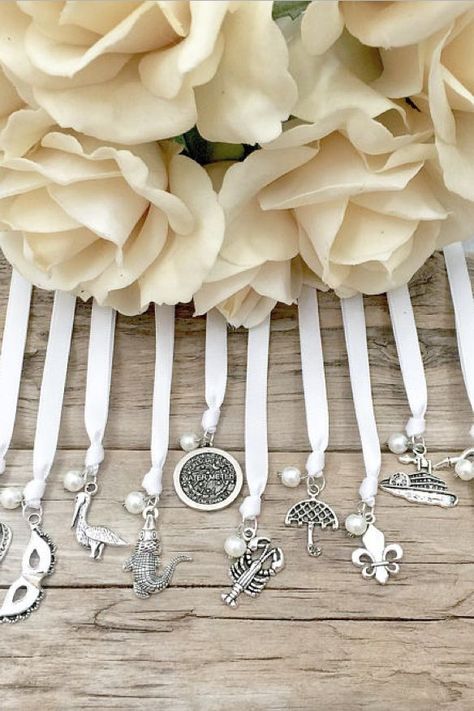 #MaggieSottero #MyLoveStory  #ShowYourCoast #CoastDiamond New Orleans Cake, Wedding Cake Pulls, Cake Pull Charms, Southern Wedding Traditions, Vow Examples, Wedding Charms, Wedding Vows Examples, Wedding Cake Ribbon, Lime Green Ribbon