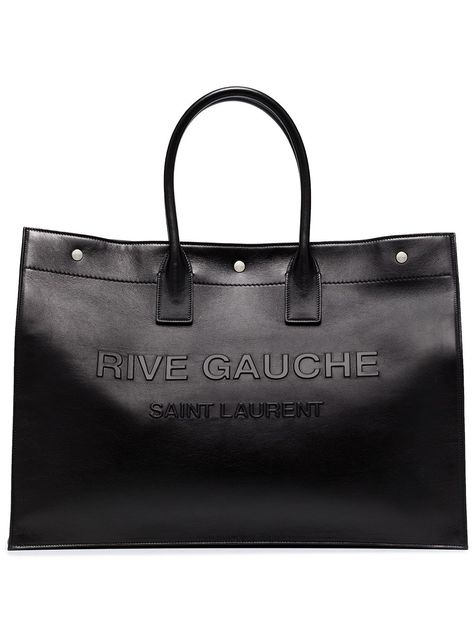 Shop or share your style of the product on ModeSens! Black leather large Rive Gauche leather tote bag from SAINT LAURENT featuring embossed logo to the front, silver-tone stud detailing, magnetic fastening, two top handles and main compartment. Saint Laurent Tote, College Architecture, Idea Product, Men Bag, Black Leather Tote Bag, Technology Accessories, Coach Horse And Carriage Tote, Rive Gauche, Leather Cap