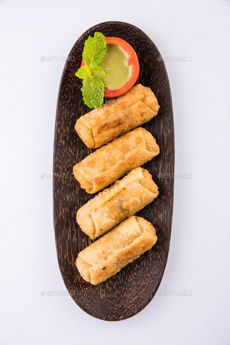 Veg Spring Rolls by stockimagefactory. Indian Veg Spring Rolls with mint leaf and green chutney or Tomato Ketchup #Sponsored #stockimagefactory, #Indian, #Rolls, #Veg Veg Roll, Veg Spring Rolls, Mint Leaf, Plain Background, Green Chutney, Spring Roll, Tomato Ketchup, Spring Rolls, Mint Leaves