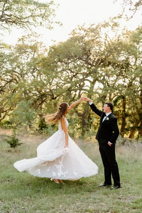 The groom twirls the bride at sunset. The bride is in a beautiful lace wedding gown. | Photo: Ashley Medrano | #weddingphotos #brideandgroom #weddingphotography #outdoorwedding #bride #weddingdress Wedding Photography Ideas Poses Romantic Photos Couple, Wedding Gown Outdoor, Bride Reveal To Groom, Wedding Photography Ceremony Outdoor, Wedding Day Photos Must Have Bride And Groom, Bride And Groom Portraits Outdoor, Fun Bride And Groom Pictures, Backyard Wedding Ceremony Photography, Wedding Poses For Bride And Groom Unique