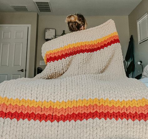 16 Beginner-Friendly Crochet Blanket Tutorials Mega Chunky Crochet Blanket Pattern, Crochet Blankets Aesthetic, Chunky Knit Blanket On Bed, Chunky Blanket Designs, Chunky Knit Blanket Designs, Chunky Knit Blanket Ideas, Hand Knit Blanket Pattern, Crochet Blanket Aesthetic, Chunky Knit Blanket Pattern Color Combos