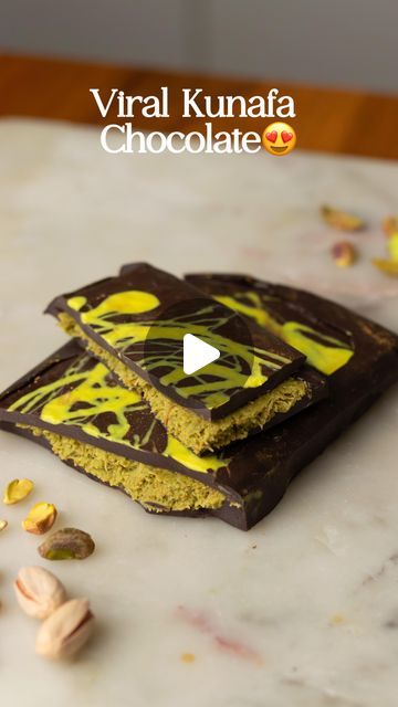 Saloni Kukreja🌷 on Instagram: "Viral Kunafa Pistachio Chocolate Bar 😍😍 The easiest way to make this recipe at home without a mold! The pistachio filling uses simple, readily available ingredients. This doesn’t disappoint, I recommend it 10/10!!   Ingredients:   •1/3rd cup roasted pistachios - ground up   •1/2 cup white chocolate   •1 teaspoon Tahini  •Green food colour (optional) • 1-2 Tbsps Pistachio butter(optional)   Chocolate:    •1/3rd cup dark compound or dark chocolate   •1/3rd cup milk compound or milk chocolate    • 3 Tbsps Ghee   •1/2 cup Kunafa - chopped   •2 tbsps white chocolate + Yellow colour or turmeric powder   Process:  - Start by melting the white chocolate and add turmeric powder for the colour  - Line your tin with parchment paper - you could also use a silicone mou Pistachio Kunafa Chocolate Bar, Kanafeh Chocolate Bar, Kunafa Chocolate Recipe, Chocolate Kunafa Recipe, Kunafa Chocolate Bar, Saloni Kukreja, Kunafa Chocolate, Pistachio Filling, Kunafa Recipe