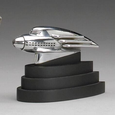 rare 1936 'streamliner' Hupmobile mascot designed by Raymond Loewy Streamlining Design, Raymond Loewy Design, Robot Project, Streamline Art, Car Mascot, Deco Statue, Car Hood Ornaments, Raymond Loewy, Art Deco Inspiration