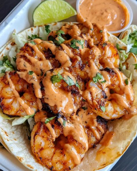 These Bang Bang Shrimp Tacos are an explosion of flavor with a mix of spicy, creamy, and crispy goodness. Perfect for a fun taco night or to impress your guests, this recipe is easy to follow and incredibly delicious. Popcorn Shrimp Tacos With Cabbage Slaw, Baked Shrimp Tacos Oven, Shrimp Taco Toppings, Seafood Tacos Recipes, Boom Boom Shrimp Tacos, Shrimp Tacos With Cabbage Slaw, Bang Bang Shrimp Tacos, Best Shrimp Taco Recipe, Shrimp Taco Sauce