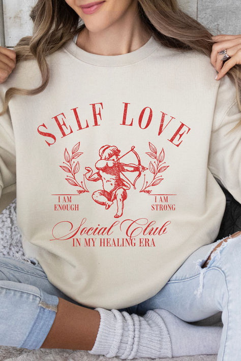 Get ready to be OBSESSED with your new favorite Self Love Social Club Sweatshirt. It's the cutest and most trendy way to emit all those Coquette Healing Era vibes! It is the perfect graphic sweatshirt to throw on all day every day! Crafted from the softest fabric, this Gildan 18000 sweatshirt ensures the utmost comfort throughout the day. Social Club Aesthetic, In My Healing Era, Clothing Coquette, Comfy Sweatshirts, Coquette Clothing, Healing Era, Coquette Top, Club Aesthetic, Self Love Club