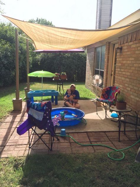 Our DIY rental house patio makeover with movable 10x13 shade sail attached to spray painted PVC pipe cemented into 5-gal buckets. All for just under $100. Plus we repurposed leftover pavers from the previous tenant to extend the existing concrete patio slab. Perfect for our family during those hot Texas summers!!! Temporary Patio Ideas For Renters, Backyard Rental House Ideas, Extend Concrete Patio, Leftover Pavers, Sunshade Ideas, Rental Backyard, Concrete Patio Makeover, Small Outdoor Patios, House Patio