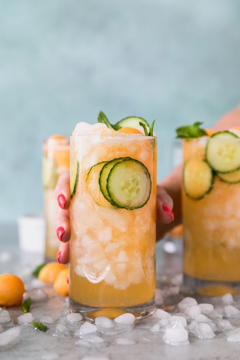 These Cucumber Melon Gin Spritzers are the most refreshing summer cocktail! They're made with a cantaloupe simple syrup, fresh mint, sliced cucumber, gin of course, and a splash of soda water! #cocktail #gin #summercocktail Melon Cocktail, Gin And Soda, Cucumber Cocktail, Cocktail Gin, Gin Cocktail Recipes, Refreshing Summer Cocktails, Cucumber Melon, Summer Cocktail Recipes, Vodka Drinks