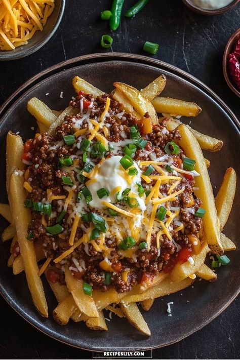 Dive into this ultimate comfort food with my Cheesy Loaded Chili Fries! Crispy fries topped with savory chili, gooey cheese, and a dollop of sour cream make this dish irresistible. Perfect for game day or a cozy night in, this recipe brings warm flavors and smiles. Try it out and elevate your snack game! Loaded Chili, Chili Fries, Crispy Fries, French Fries Recipe, Ground Beef And Potatoes, Paprika Potatoes, Game Snacks, Cubed Potatoes, Crispy Fry