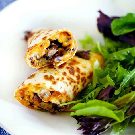 These 10-minute Tortilla Egg Wraps, inspired by "Nadiya's Time to Eat," are packed with Mediterranean flavor from mushrooms and olives! Egg Mushroom, Egg Wraps, Eggs And Mushrooms, Batch Recipes, Olive Bowl, Fitness Meals, How To Make Tortillas, Easy To Make Breakfast, Pulled Pork Leftovers