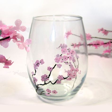 How to hand paint glass with flowers such as these lovely spring cherry blossoms using Martha Stewart Crafts glass paint and simple wine glasses from a dollar store. DIY, handmade, Martha Stewart Crafts, Glass Paint, Cherry Blossom, how-to, Pink flowers, Cherry Tree, make your own, homemade Camping Wine Glasses, Goodbye Winter, Diy Wedding Video, Glass Painting Designs, Amazing Finds, Martha Stewart Crafts, Wine Glass Crafts, Cherry Blossom Branch, Wine Glass Art