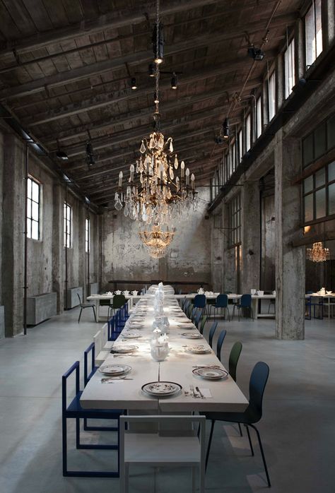 Michelin-starred chef Carlo Cracco and art director Tanja Solci have joined forces to create Carlo e Camilla in Segheria, the latest addition to Milan's fertile restaurant scene, housed in a defunct sawmill acquired by Solci's grandparents in the 1930s. The soaring structure's brick and raw cement bones give the space a pared back, industrial look - a foil for the otherwise super-polished dining experience. Milan Restaurants, Industrial Chic Wedding, Design Library, Wallpaper Magazine, Style Loft, Long Table, Design Industrial, Milan Design Week, Industrial House