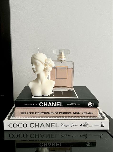 CHANEL Perfume, Homemade Candle, and a Stack of Fashion Books Designer Book Aesthetic, Dior Book Decor, Little Book Of Chanel, Fashion Themed Room, Chanel Aesthetic Bedroom, Chanel Book Aesthetic, Coco Chanel Room, Fashion Books Decor, Fashion Aesthetic Room