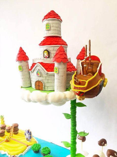 Super Mario Map Cake - CakeCentral.com Mario Castle, Floating Castle, Map Cake, Blow Fish, Mario Birthday Cake, Fish Rocks, Mario Cake, Small Castles, Castle Cake