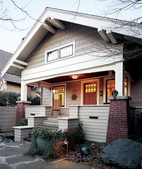 Hallmarks of the Bungalow style include tapered brick piers, a deep front gable, and a welcoming porch. Arts And Crafts Bungalow Exterior, Exterior House Trim, Floor Plans Bungalow, House Plans Bungalow, Craftsman Exteriors, Craftsman Style Porch, Craftsman Style Interiors, House With Garage, Florida Bungalow