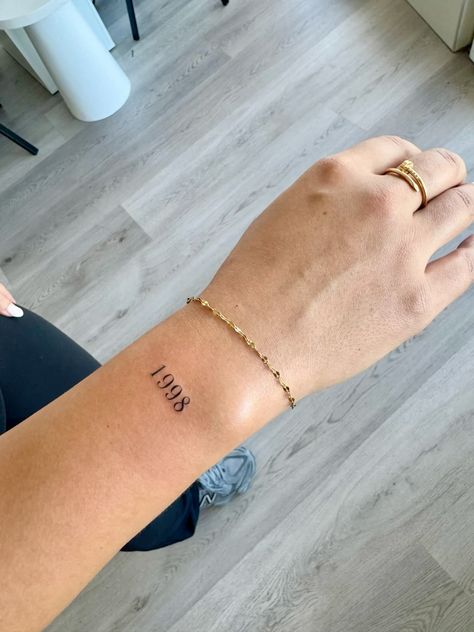 Year Wrist Tattoos, Tattoo Year Of Birth, New Year Tattoo Ideas, December Birthday Tattoo, Birth Year Tattoo Placement, Time Of Birth Tattoo, Birthdate Tattoo Ideas, Year Tattoo Number, 1999 Tattoo