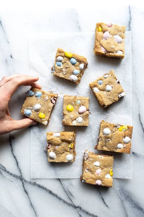 These Cadbury Mini Egg Blondies are the perfect way to incorporate everyone's favorite Easter candy into a delicious baked good. Mini Egg Blondies, Cadbury Mini Egg Cookies, Female Foodie, Mini Eggs Cookies, Cadbury Mini Eggs, Offset Spatula, Cadbury Eggs, No Egg Desserts, Easter Egg Cookies