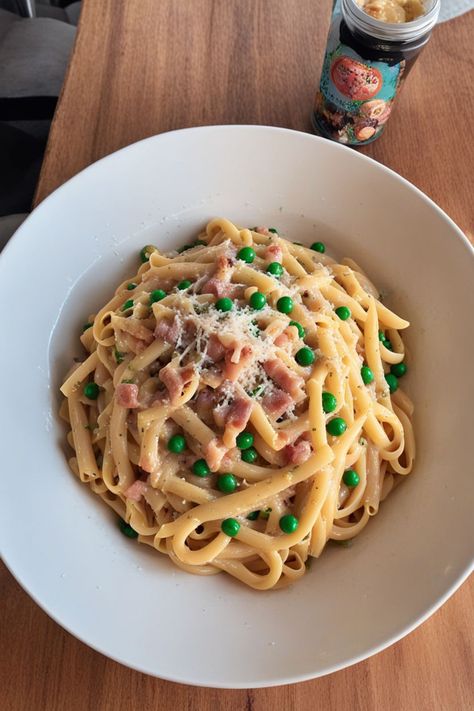 Pasta Carbonara with Peas Recipe

Ingredients

- 8 ounces spaghetti
- 1 cup frozen peas
- 4 ounces pancetta or guanciale, diced
- 2 large eggs
- 1 cup grated Parmesan cheese
- Salt and black pepper to taste
- Fresh parsley, chopped (for garnish)

Instructions

- Cook spaghetti according to package instructions in salted water. Add peas during the last 2 minutes of cooking; drain and reserve some pasta water. 
- In a large pan, cook pancetta over medium heat until crispy. In a bowl, whisk together eggs and Parmesan cheese until smooth. 

Full Recipe on... Pasta Carbonara With Peas, Carbonara With Peas, Homemade Carbonara, Spaghetti Dishes, Pancetta Pasta, Carbonara Sauce, Boiling Pasta, Peas Recipe, Dinner Ideas Recipes