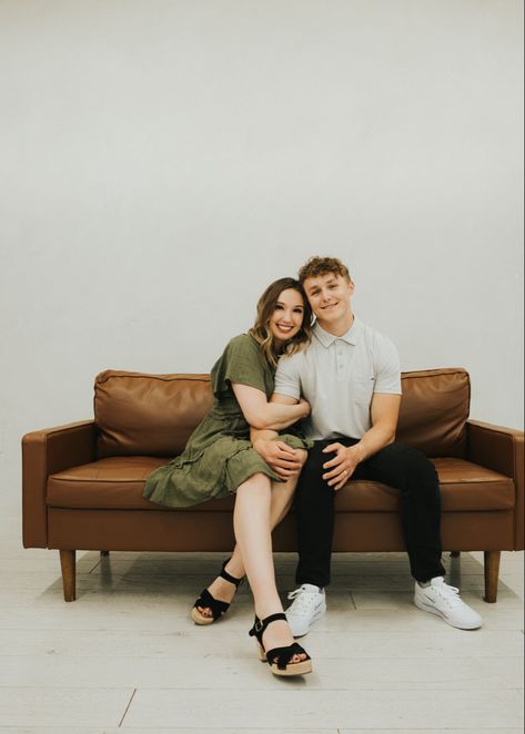 Couples Sitting Poses Couch, Family Poses On Couch, Leaning Couple Pose, Couples Chair Poses, Couple Seating Pose, Sitting Down Poses Chair, Family Pictures On Couch, Couch Photoshoot Ideas Couple, Family Photoshoot Couch