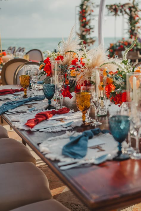 Orange Blue Table Setting, Blue And Orange Mood Board, Wedding Palette Blue, Wedding Table Settings Blue, Beach Wedding Table Settings, Orange And Blue Wedding, Beach Table Settings, Glass With Flowers, Blue Table Settings