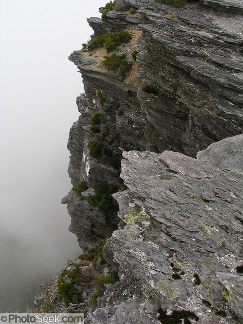 Bluff Knoll rises to 1099 metres (3606 feet) above sea level in the Stirling Range in Western Australia. Its aboriginal name Koikyennuruff describes the “place of ever-moving about mist and fog.” Bluff Knoll is one of only a few places to receive regular snowfalls in most years in Western Australia (WA). Stirling Range National Park was declared in 1913 and is now an ecological island in a sea of farmland. 1500 species of flora are packed within the park, more than in the entire British Isles. Weathering And Erosion, River Delta, Stirling, Sea Level, Plant Species, South Pacific, Round Trip, British Isles, Pacific Ocean