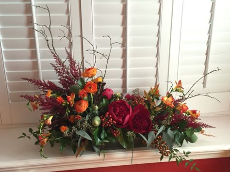 Thanksgiving long and low centerpiece by Fleur de Vie. Long Low Floral Arrangements, Long Low Centerpieces, Long And Low Floral Centerpiece, Long And Low Flower Arrangement, Long And Low Centerpiece, Low Floral Arrangements, Farm Market Ideas, Fall Flower Centerpieces, Thanksgiving Flower Arrangements