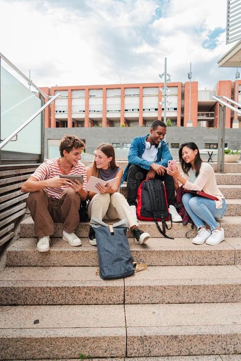 Vertical. Group of multiracial high school students talking on a staircase at university campus, using a tablet app and royalty free stock photograp College Student Photoshoot, High School Photoshoot, School Group Photos Student, College Campus Photography, Classroom With Students Photography, Huge School Campus, University Campus, School Students, High School Students