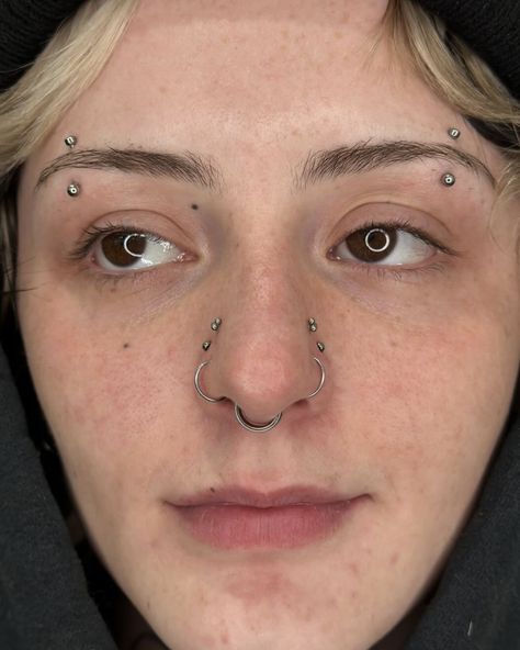 REACHING NEW HEIGHTS WITH THIS STYLISH HIGH NOSTRIL PIERCING! 😁  HIGH NOSTRIL PIERCING BY @marcymods  Soho, Union Square, and Williamsburg  11AM-9PM 7 DAYS A/W🕘 WALK-INZ OR BOOK ONLINE..📕 TATTOOS & PIERCINGS, NO ATTITUDE, NO MISERABLE HOOPS TO JUMP THROUGH....🚫  WALK-INZ WELCOME OR BOOK ONLINE AT  ⚔️livebytheswordtattoo.com⚔️ . . . . #highnostrilpiercing #nostrilpiercing #piercings #nosepiercing #nosejewelry #highnostril High And Low Nostril Piercing, Upper Nostril Piercing, Right Nostril Piercing, Multiple Nostril Piercings, High Nostrils With Chain, Nostril Piercing, Nostril Piercing Jewelry Hoop, High Nostril Piercing, Cool Piercings