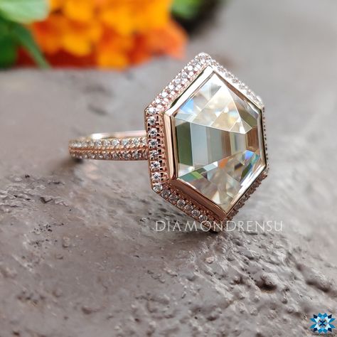 Embrace timeless elegance with our Hexagon Rose Cut Engagement Ring. Masterfully crafted, this piece features an antique cut moissanite, nestled within a hexagonal halo and a two-row pave band. The bezel setting enhances the step-cut stone, presenting a harmonious blend of classic charm and modern flair. Perfect for those seeking a unique, rose gold wedding ring, it embodies the essence of love and commitment. Experience the luxury of customizing your dream jewelry with us. The stones in the jew Round Diamond Hexagon Halo, Anniversary Rose Cut Diamond Ring Octagon Shaped, Anniversary Rose Cut Diamond Ring With Octagon Shape, Anniversary Octagon Ring With Rose Cut Diamonds, Anniversary Octagon Rose Cut Diamond Ring, Elegant Octagon Diamond Ring With Bezel Setting, Formal Octagon Diamond Ring With Rose Cut Diamonds, Wedding Asscher-cut Diamond Ring With Bezel Setting, Asscher Cut Diamond Ring With Bezel Setting For Wedding