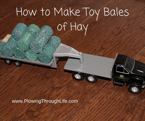 how to make toy bales of hay text on toy truck pic pulling bales of hay Farm Toys Diy, Ertl Farm Display, Ertl Farm Toys, Farm Toy Display Diy, Mini Farm Ideas, Farm Table Plans, Wooden Toy Farm, Farm Toy Display, Farm Display