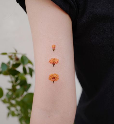 49 Birth Flower Tattoos That Celebrate Each Month of the Year | 49 Birth Flower Tattoos Move over astrology tattoos, birth flower tattoos are blooming with possibility! Entertainment Marigold Tattoo, Astrology Tattoo, White Ink Tattoo, Birth Flower Tattoos, Flower Tattoo Designs, Little Tattoos, Birth Flower, Couple Tattoos, Mini Tattoos