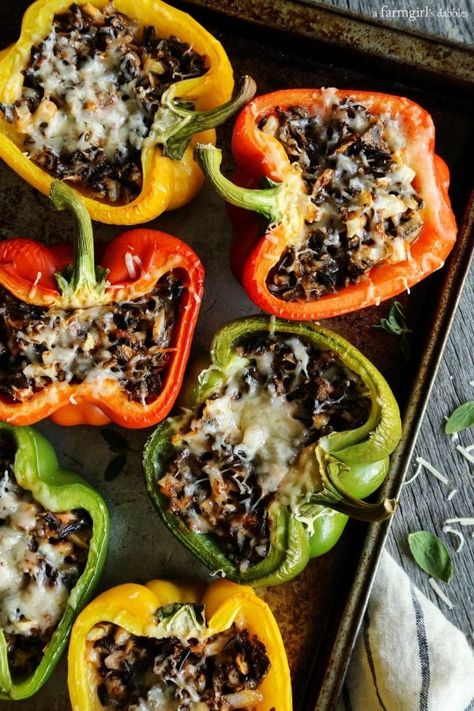 Mushroom and Wild Rice Stuffed Peppers from afarmgirlsdabbles.com Mushroom Stuffing Recipes, Mushroom Stuffed Peppers, Rice Stuffed Peppers, Stuffed Capsicum, Mushroom Stuffing, Yummy Vegetables, Stuffed Peppers With Rice, Fall Eats, Mushroom Stuffed