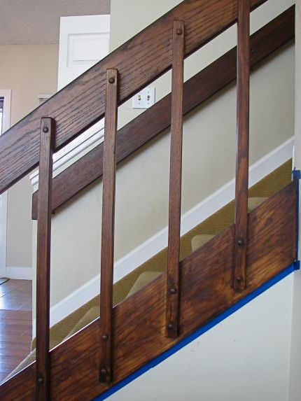 After one coat of stain Tri Level House, Banister Remodel, 80s House, Split Foyer, Foyer Staircase, Stair Rail, Brown Doors, Oak Trim, Staircase Makeover