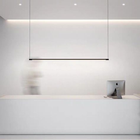 Looking to achieve that designer or architectural look with a modern light fixture that is both sleek and functional for either an urban home or commercial application? This black minimalist linear LED pendant fixture is suspended with wires to give the illusion of invisibility without any extra frills for simple sophistication. Perfect for hanging over a dining table, boardroom table, kitchen counter, bar, work surface or reception counter. Is Bulbs Included: Yes, Power Source: AC, Installation Linear Pendant Light, Reception Counter, Boardroom Table, Black Minimalist, Counter Bar, Minimalist Lighting, Pendant Fixture, Linear Lighting, Table Kitchen