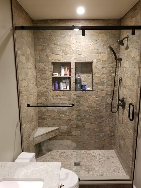 Natural Stone In Bathroom, Stone Tile Shower Wall, Shower Remodel Brown Tones, Showers With River Rock Floors, Small Stone Shower Ideas, Bathroom Floor And Shower Tile Combos, Shower Rock Tile Ideas, Farmhouse Master Bathrooms With Walk In Showers, Stone Wall Shower Ideas