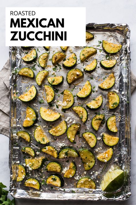 looking down at a baking sheet of sliced roasted mexican zucchini. Mexican Roasted Zucchini, Mexican Style Zucchini, Mexican Zucchini Side Dish, Mexican Zucchini Recipes, Healthy Mexican Side Dishes, Mexican Vegetable Sides, Zucchini Mexican, Zucchini Tacos, Zucchini Side Dish Recipes