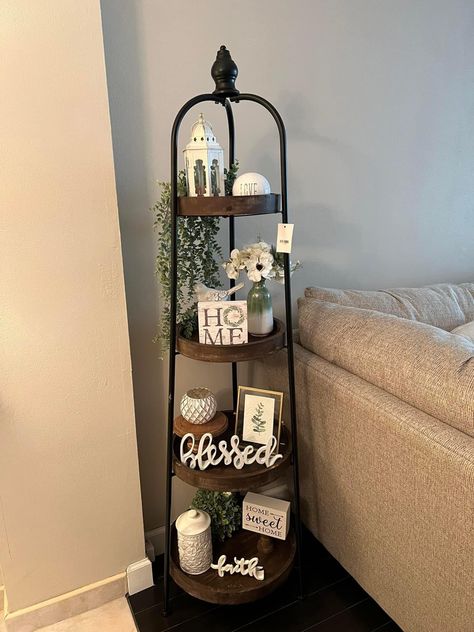 4 Tier Stand Decor, Tier Shelf Decor Living Rooms, Four Tier Shelf Decor, Standing Shelf Decor Living Room, How To Decorate A 4 Tier Shelf, Year Round Home Decor, Corner Shelf Decor Living Room, Plant Display Indoor Living Rooms, Farmhouse Shelf Decor Living Room