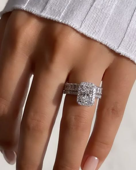 Nuno Rocha on Instagram: "Introducing this breathtaking @diamondboi engagement ring, a true masterpiece that exudes elegance and sophistication. This exquisite ring features a dazzling 2.00ct radiant cut diamond, expertly placed in a cut cornered halo setting, accentuating its brilliance and fire. The halo design adds a touch of glamour and creates a mesmerizing focal point. To complete the ensemble, this stunning ring is paired up with a radiant cut eternity band, showcasing a continuous row of radiant cut diamonds, symbolizing eternal love and commitment. Crafted with meticulous attention to detail, this @diamondboi engagement ring is a testament to timeless beauty and impeccable craftsmanship, making it the perfect symbol of your everlasting love story. Why join the @diamondboi family Radiant Halo Engagement Ring With Band, Radiant Cut With Diamond Band, Radiant Engagement Ring With Halo, Radiant Cut Engagement Ring With Halo, Square Engagement Rings Silver, Radiant Eternity Band, Halo Engagement Ring With Wedding Band, Radiant Cut Engagement Ring With Band, Engagement Rings And Wedding Bands Set