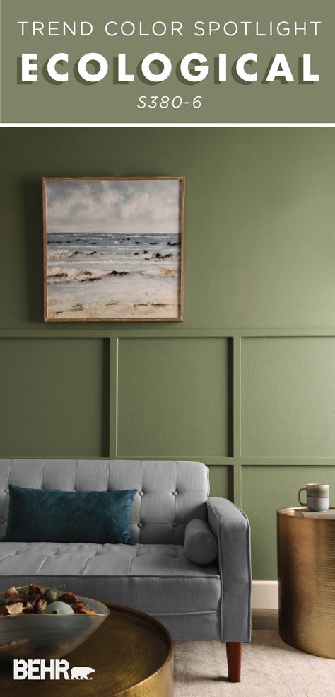 An earthy and relaxing shade of green, make Ecological by Behr Paint a featured color in your home. This living room uses pops of gold, painted wall paneling, wall art, and mid-century modern furniture to create a curated space. Click below to discover more design inspiration. Green Painted Walls Behr, Behr Ecological, Behr Perennial Green, Behr Village Green Bedroom, Behr Ecological Green Paint, Living Room Furniture Trends, Green Wall Color, Behr Colors, Modern Rustic Living Room