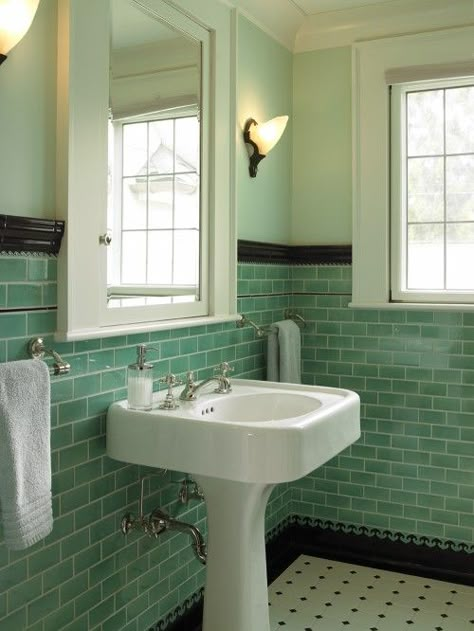 Classic vintage style can transform a bathroom into a little jewel box. The height of this tile, coupled with the natural light, reflects and shines; the black and white tile accents give it fun apothecary appeal. Classic Bathroom Tile, Traditional Powder Room, Vintage Tegel, Vintage Medicine Cabinets, Green Tile Bathroom, Craftsman Bathroom, Retro Bathrooms, Deco Bathroom, Room Tiles