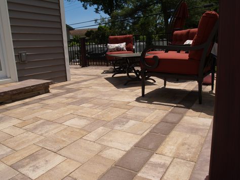 Beautiful tan pavers on this raised patio with brown accent pavers. All designed and installed by Topaz Design Group. For more information feel free to visit our website at www.topazlandscape.com #cambridgepavers #pavers #patio #patiodesigns Paver Patio With Grass In Between, Wood Deck And Paver Patio Combo, Beige Pavers Outdoor, Brown Paver Patio, Expand Patio With Pavers, Pool Patio Designs, Raised Patio, Patio Pavers Design, Front Deck