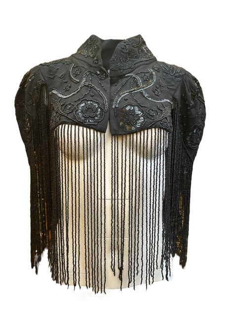 Powerful and polished, the Desert Shrug is defined by its rich detail and rebellious nonchalance. A hand-beaded shrug, this layering piece looks good with a simpler top underneath. Beading features lizards, desert fauna and flora, with long lines of delicate fringe. To care for this item, please hand wash in cool water. Hang to dry. Fringe Bolero, Fauna And Flora, Bustier Bodysuit, December 2nd, Top Bustier, Bodysuit Dress, Kate Bosworth, Simple Top, Miranda Lambert